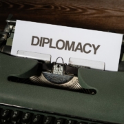 a close up of a typewriter with a piece of paper on it