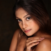 a close up of a woman posing for a picture