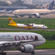 a couple of airplanes that are on a runway