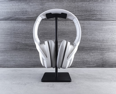 a pair of headphones sitting on top of a stand