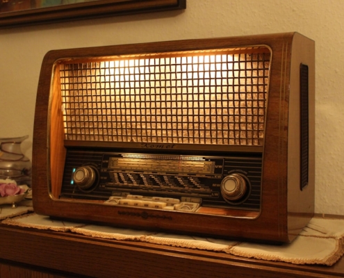 brown and black radio on brown wooden table