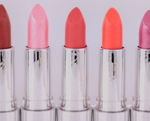 five assorted-color lipsticks