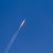 flying rocket during daytime