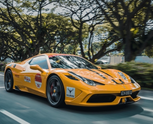 panning photography of Ferrari 458 on road