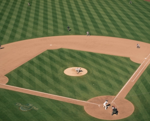 people playing baseball on field during daytime