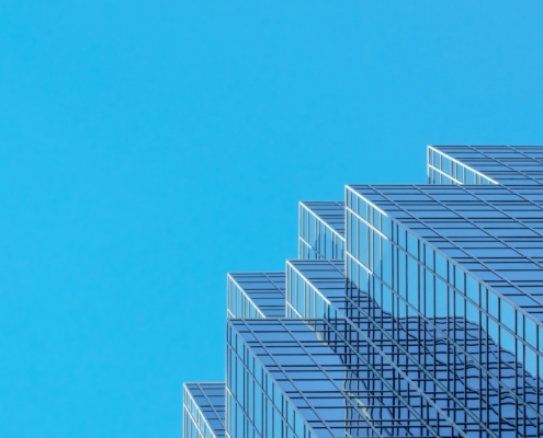 white and blue concrete building under blue sky during daytime