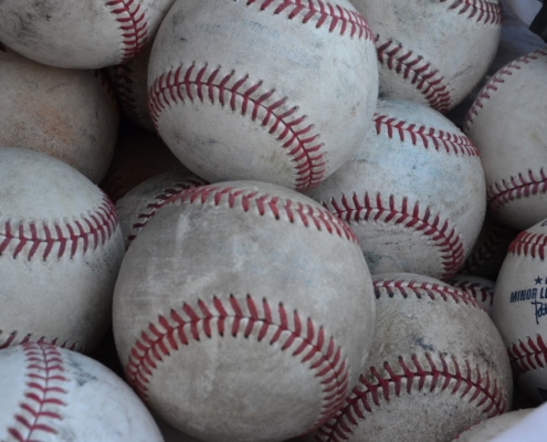 white and red baseball ball