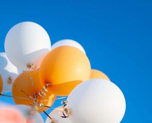 white blue and yellow balloons