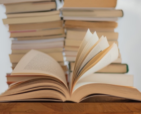 white book on brown wooden table