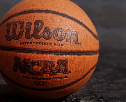 Wilson NCAA basketball on black board