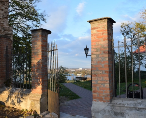 a brick building with a gate in front of it