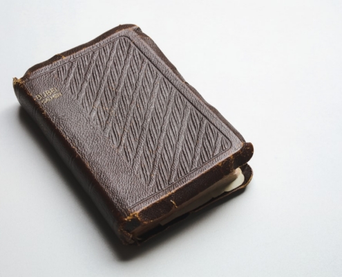 a brown leather book with a stitching pattern