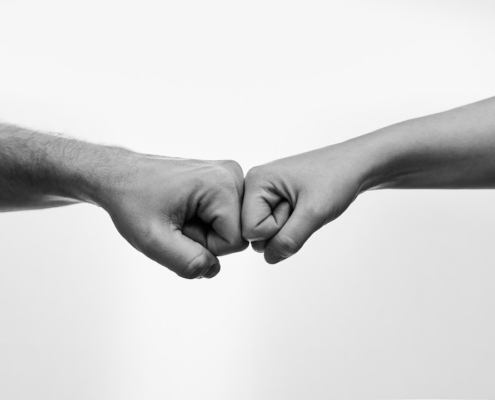 a couple of people that are holding hands