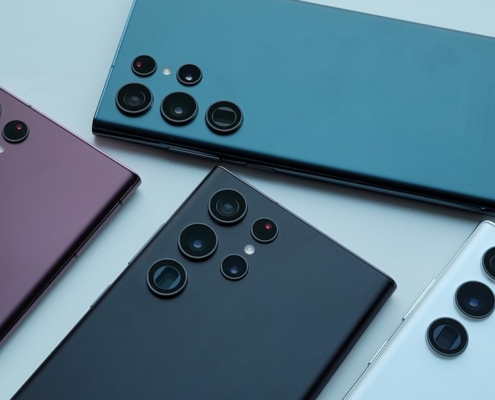 a group of four different colored cell phones