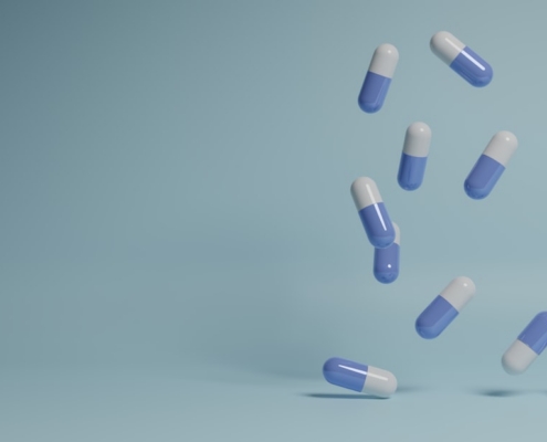 a group of pills falling into the air