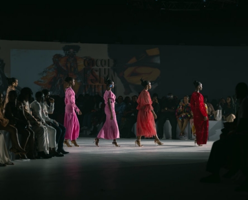A group of women walking down a runway