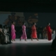 A group of women walking down a runway