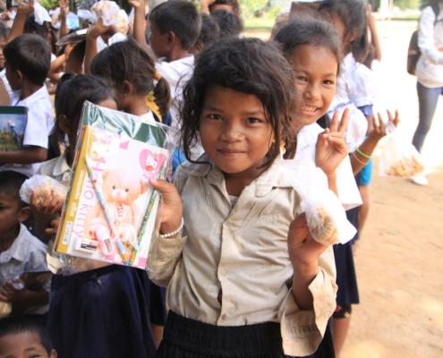 a group of young children standing next to each other