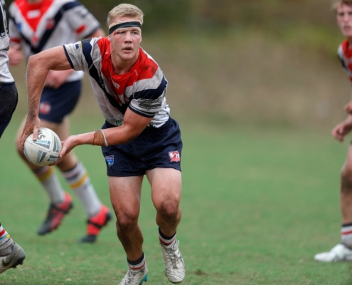 a group of young men playing a game of rugby