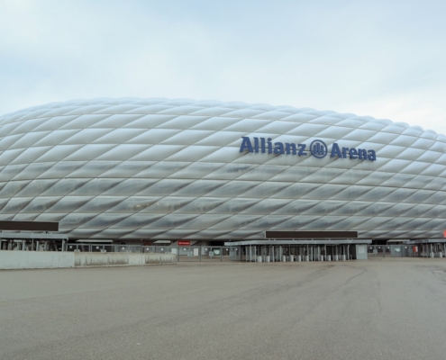 a large soccer stadium with a large white building