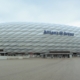 a large soccer stadium with a large white building
