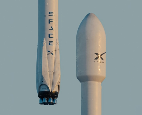 a spacex rocket is flying in the sky