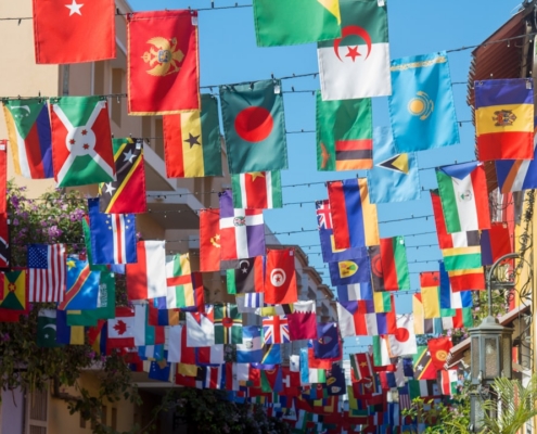 a wall with many flags from it