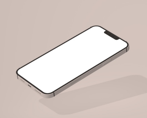 a white cell phone sitting on top of a table