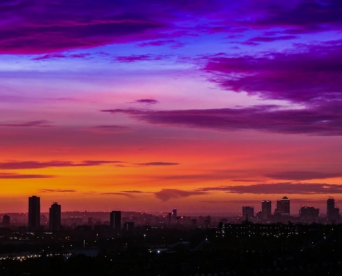 aerial photography of city with high-rise buildings during night time