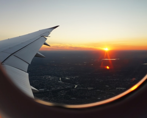 airplanes window view of sky during golden hour