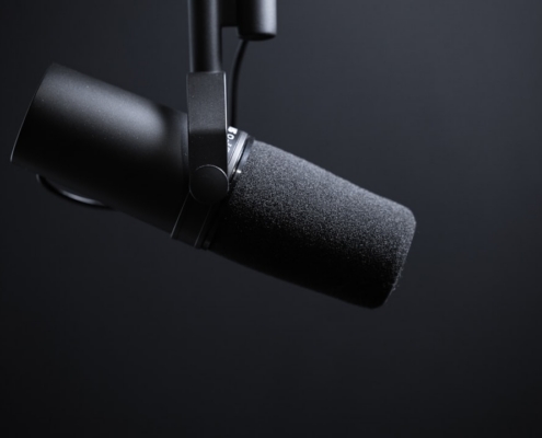 black and silver microphone with white background