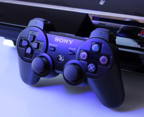 black Sony PS2 controller on white surface