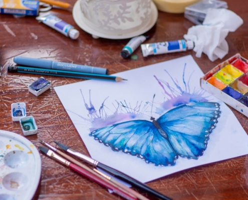 blue and purple click pen on white paper