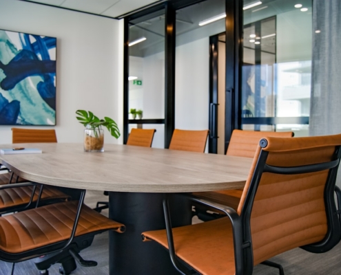brown wooden 9-piece office table and chairs