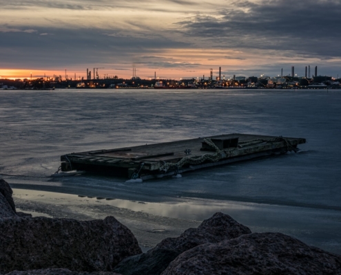 brown wooden boat on body of water