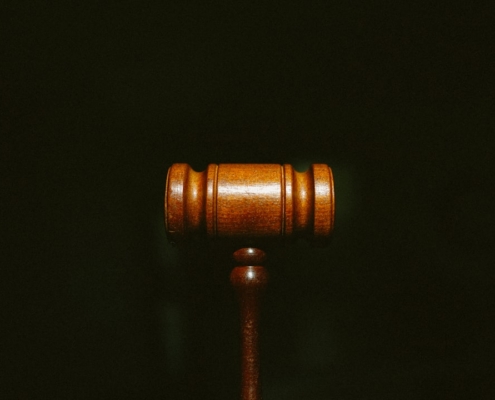 brown wooden stand with black background