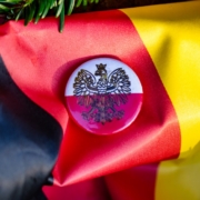 German flag with polish emblem and evergreen branch