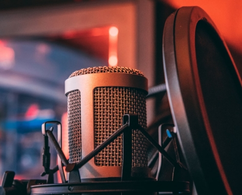 gray microphone beside of condenser