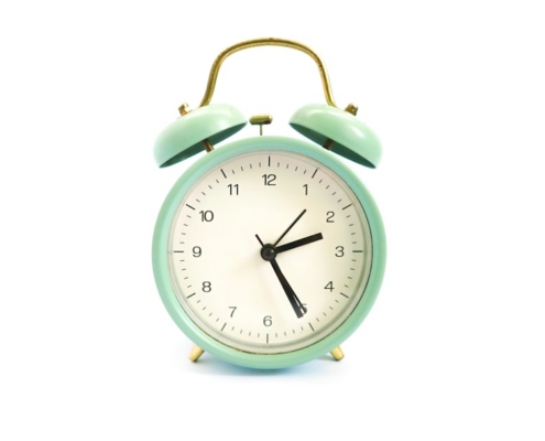 green and white alarm clock