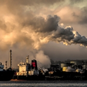 industrial harbor with smokestack pollution