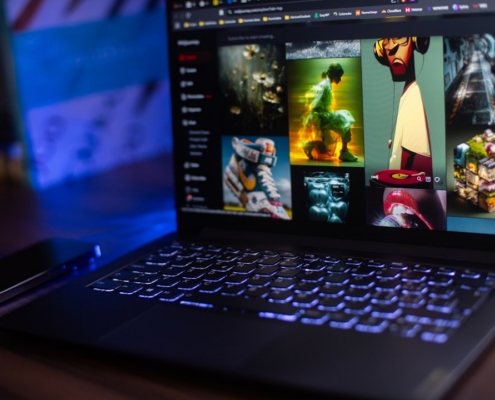 Laptop shows a streaming service with movie options.