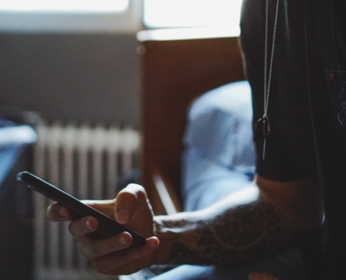man holding black phone