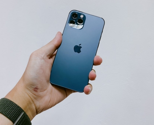 person holding blue iphone 5 c