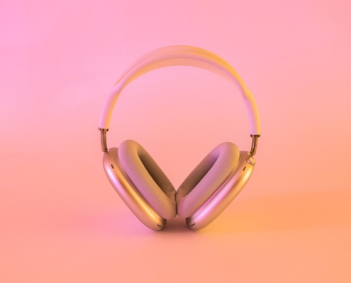 pink and white wireless headphones