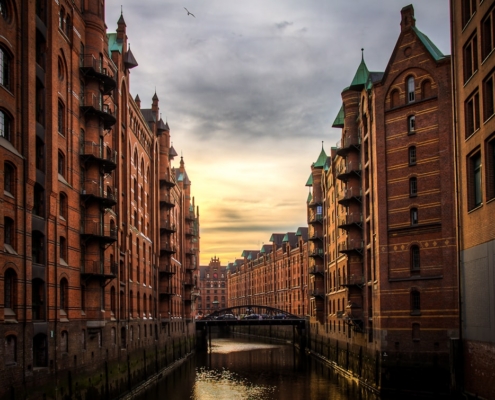 river between brown concrete buildings