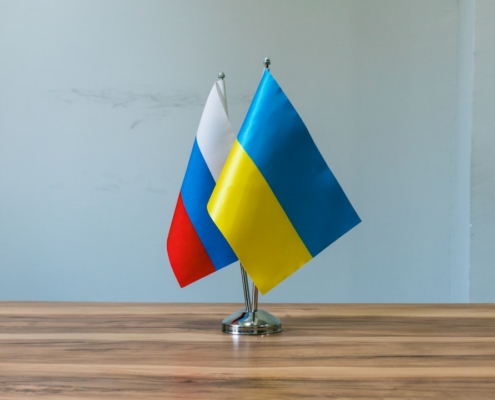 Russian and ukrainian flags on a table