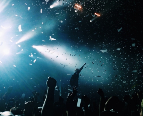 silhouette of people watching a concert