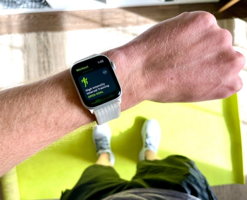 silver aluminum case apple watch with white sport band