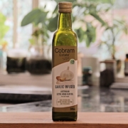 a bottle of garlic oil sitting on top of a counter