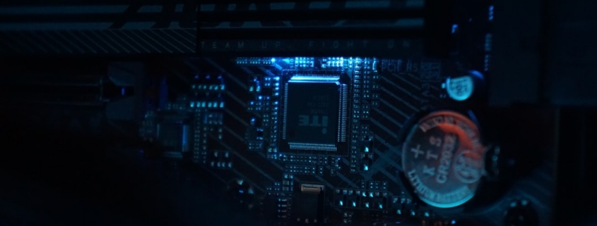 A close up of a computer motherboard in a dark room